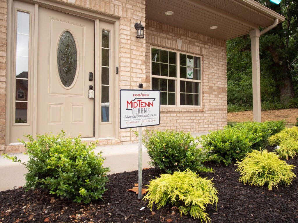 MidTenn Alarms at a Residential home in Clarksville, TN and Southern Kentucky sign out front with custom security alarm solutions